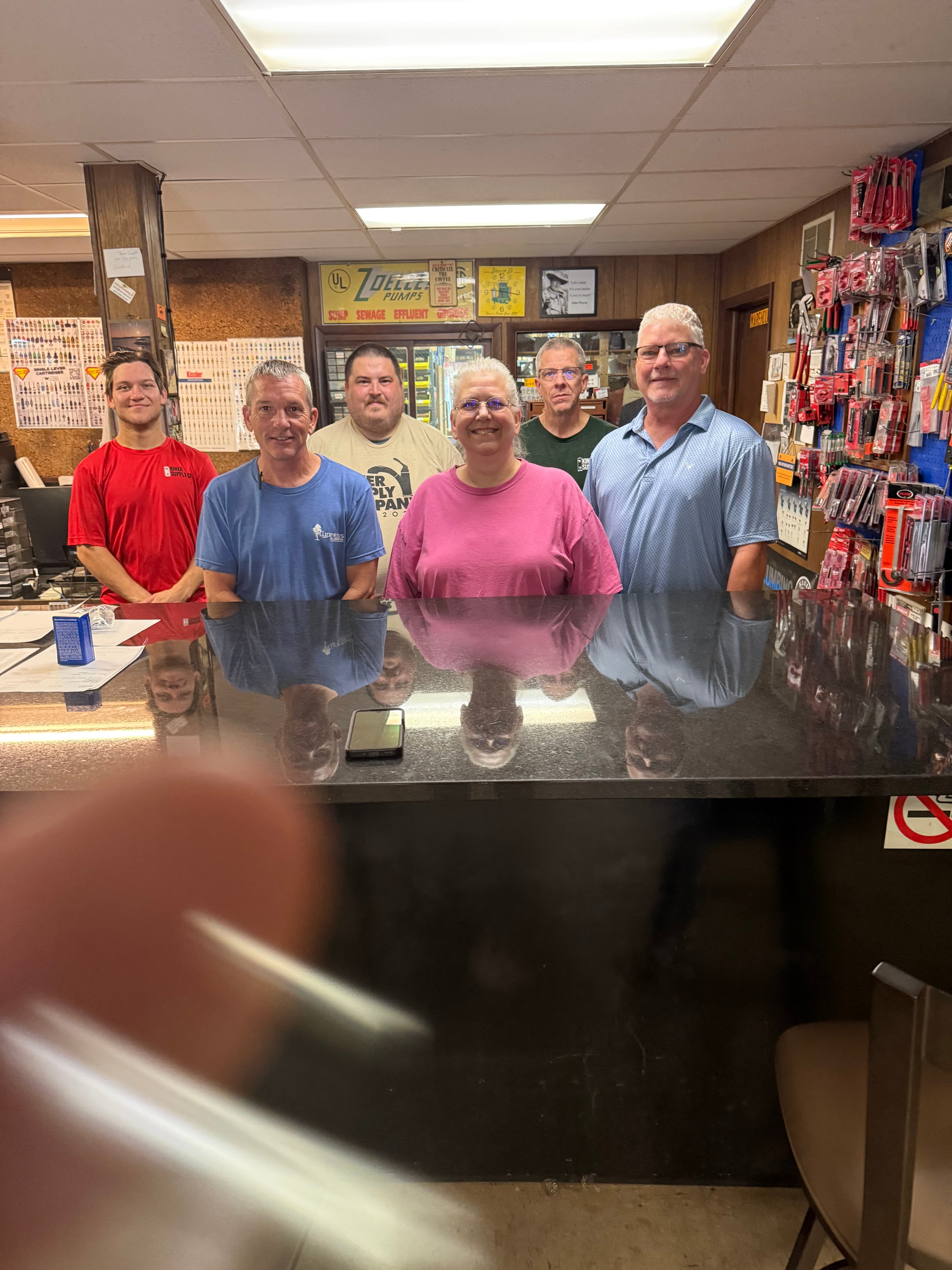 The Kiner Supply Co., Inc. team behind the front counter